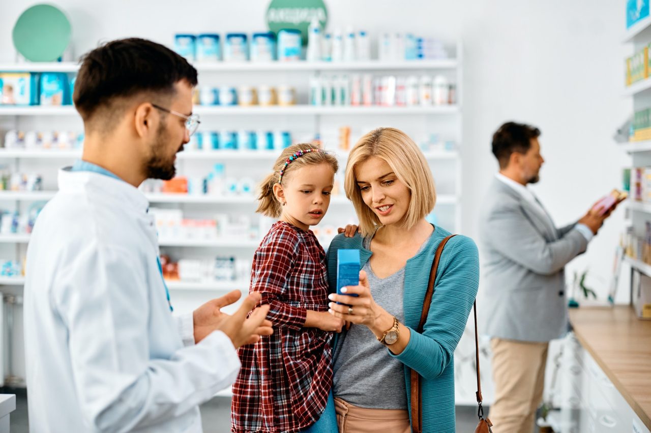 happy-mother-with-daughter-buying-in-a-pharmacy